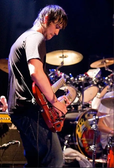 Julience playing guitar