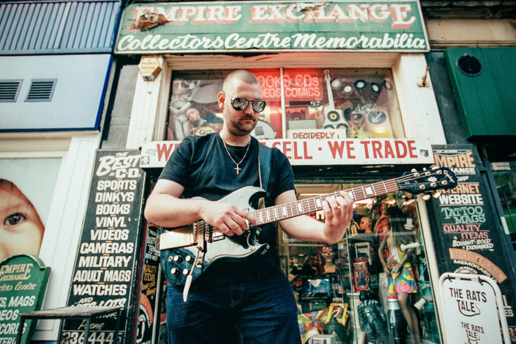 Julience playing electric guitar — Manchester indie rock photo session